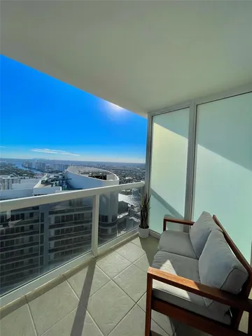 a view of a balcony with chairs