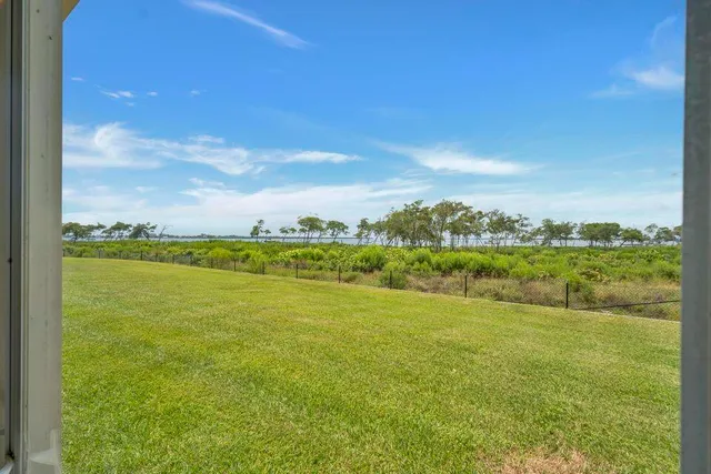 a bathroom with a double vanity sink toilet mirror and bathtub