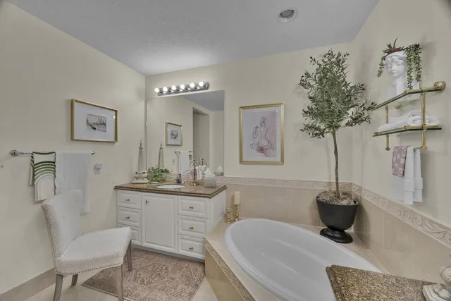 a bathroom with a double vanity sink toilet and a mirror