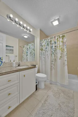 a utility room with sink dryer and washer