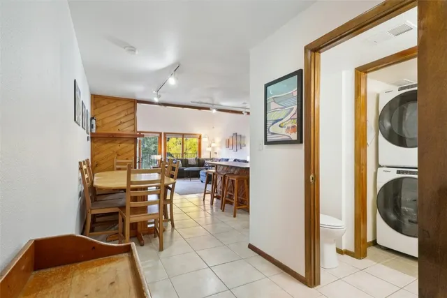 a view of a livingroom with furniture and a window