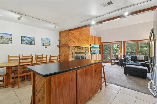 a view of kitchen with furniture and large window