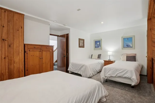 a bedroom with bed and a night stand