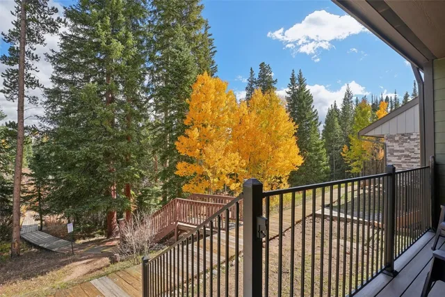 a view of a house with a patio and a yard