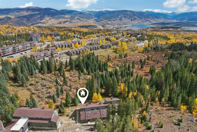 a view of a lush green hillside and houses