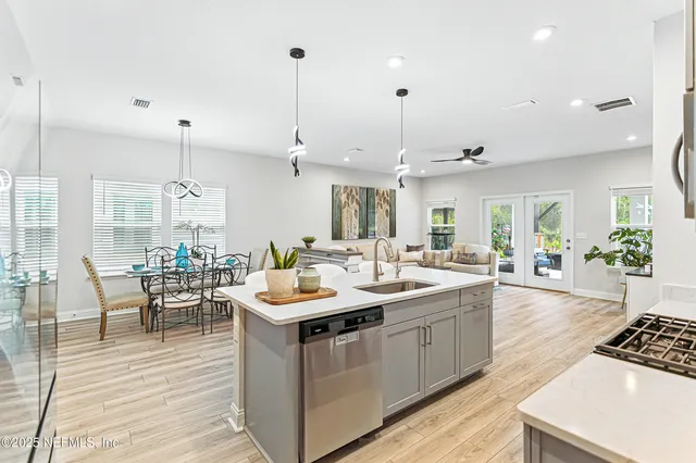 a large kitchen with a table and chairs