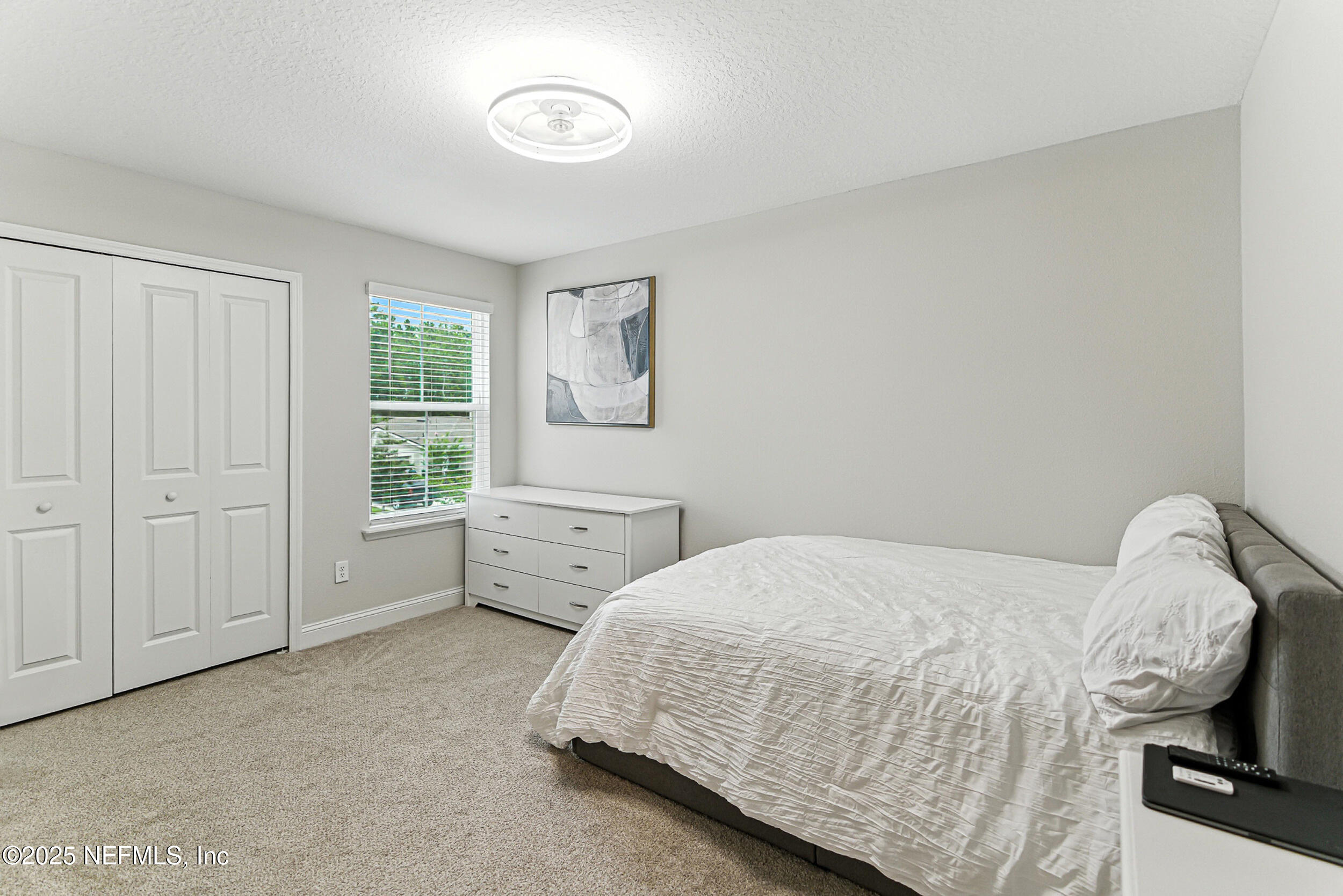 105 Meadow Creek Drive St. Johns, FL 32259 - Photo 20 of 37 a bedroom with a bed and a window
