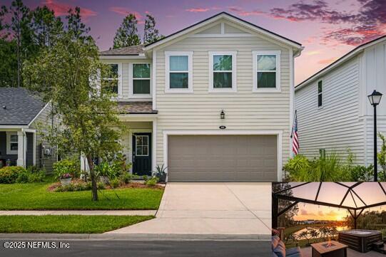 105 Meadow Creek Drive St. Johns, FL 32259 - Photo 2 of 37 a front view of a house with a yard