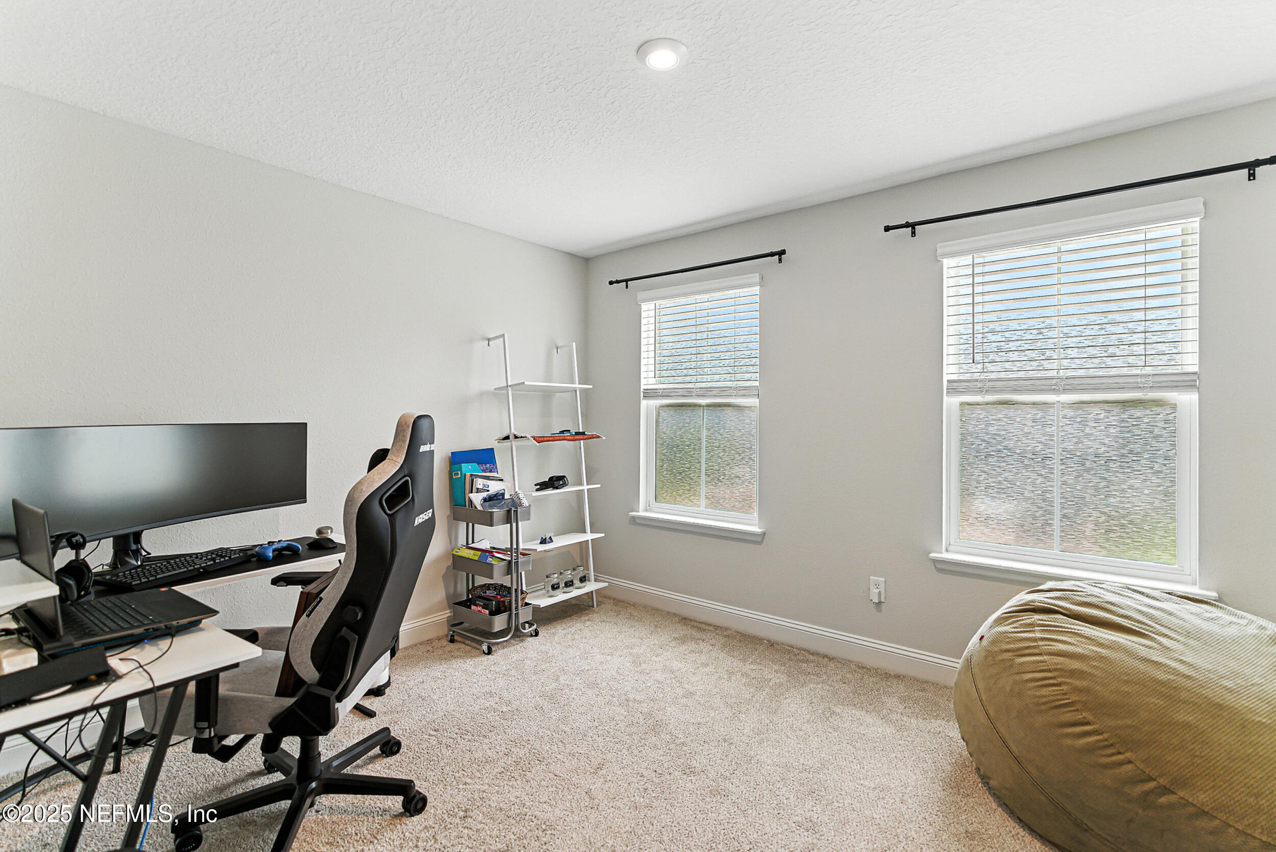 105 Meadow Creek Drive St. Johns, FL 32259 - Photo 23 of 37 a view of a workspace with furniture and a window