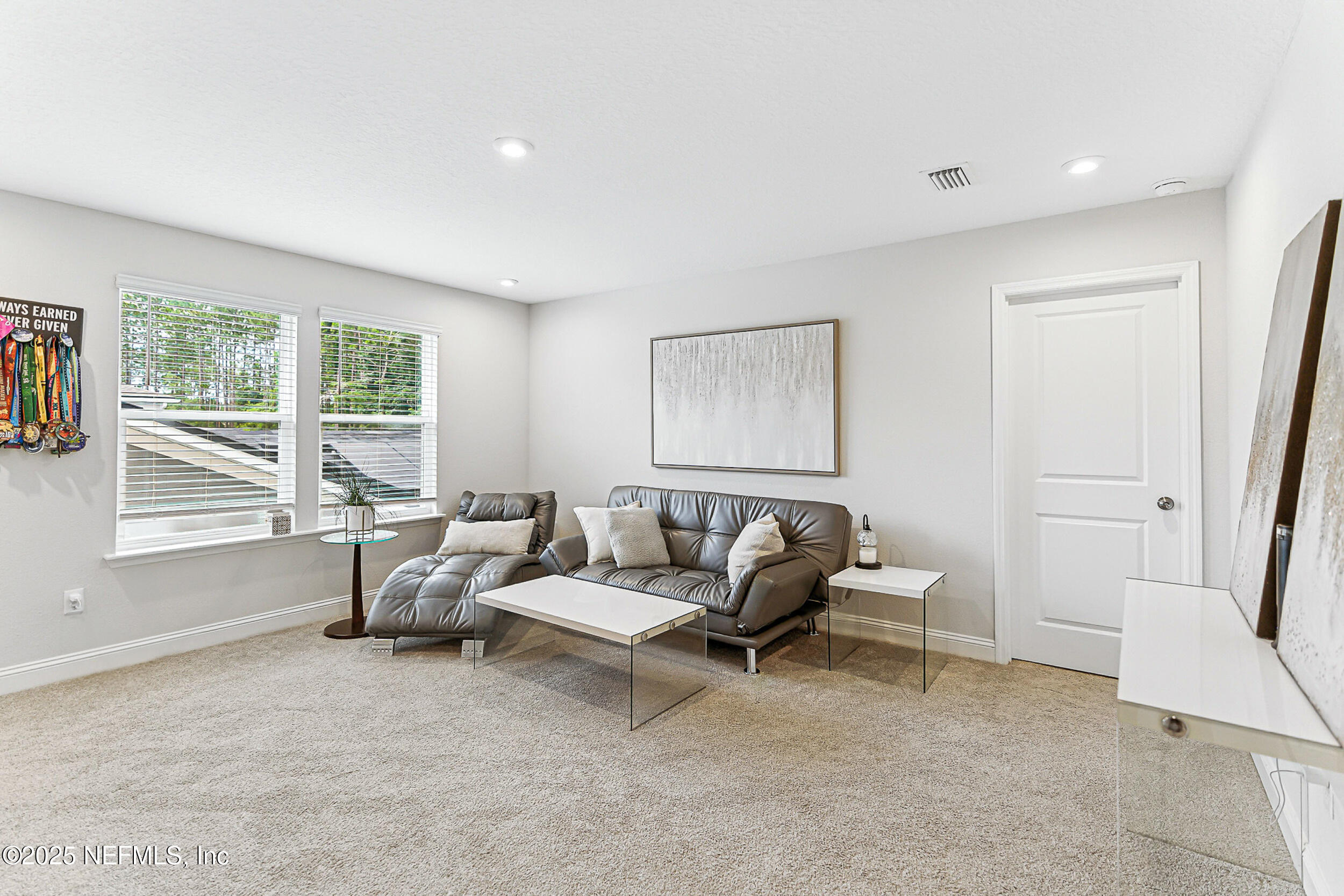 105 Meadow Creek Drive St. Johns, FL 32259 - Photo 24 of 37 a living room with furniture and a window