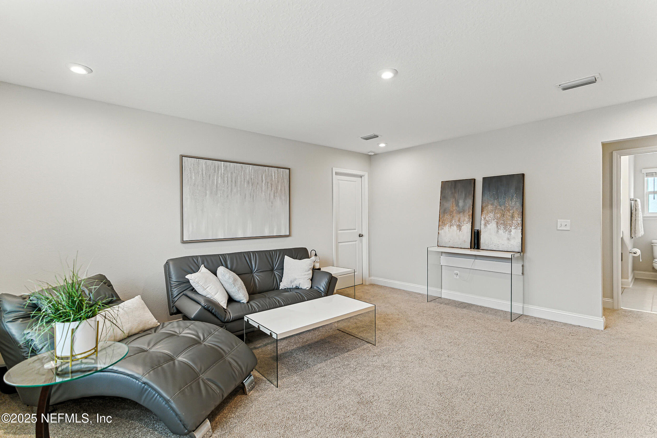 105 Meadow Creek Drive St. Johns, FL 32259 - Photo 25 of 37 a living room with furniture and wooden floor
