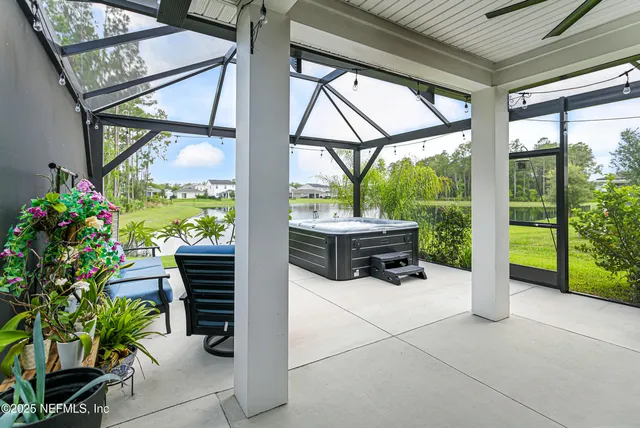 a building outdoor space with patio furniture and potted plants