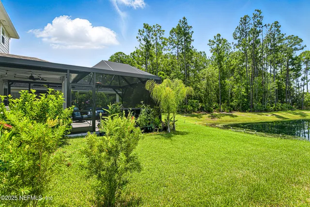 a backyard of a house with yard and outdoor seating