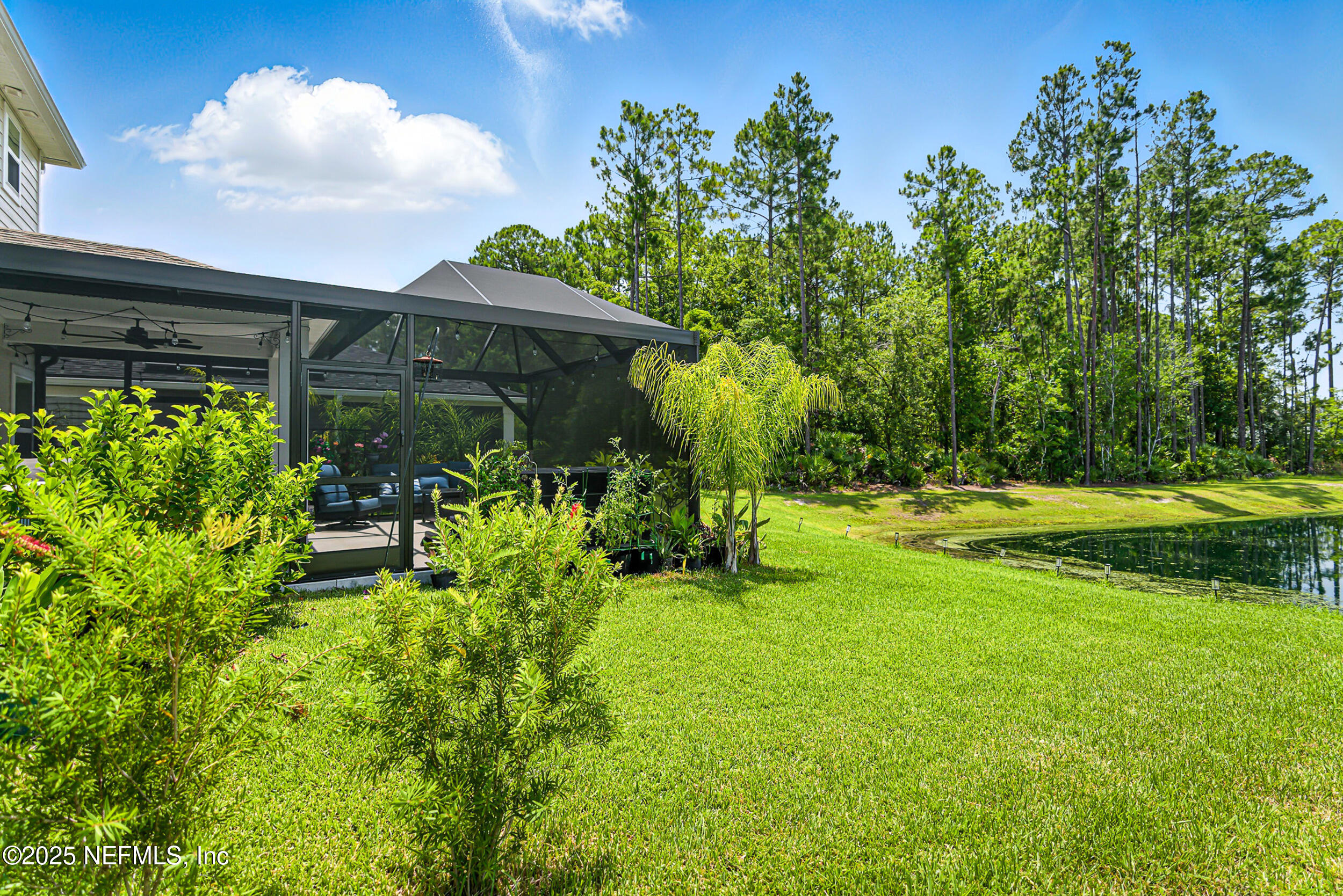 105 Meadow Creek Drive St. Johns, FL 32259 - Photo 33 of 37 a backyard of a house with yard and outdoor seating