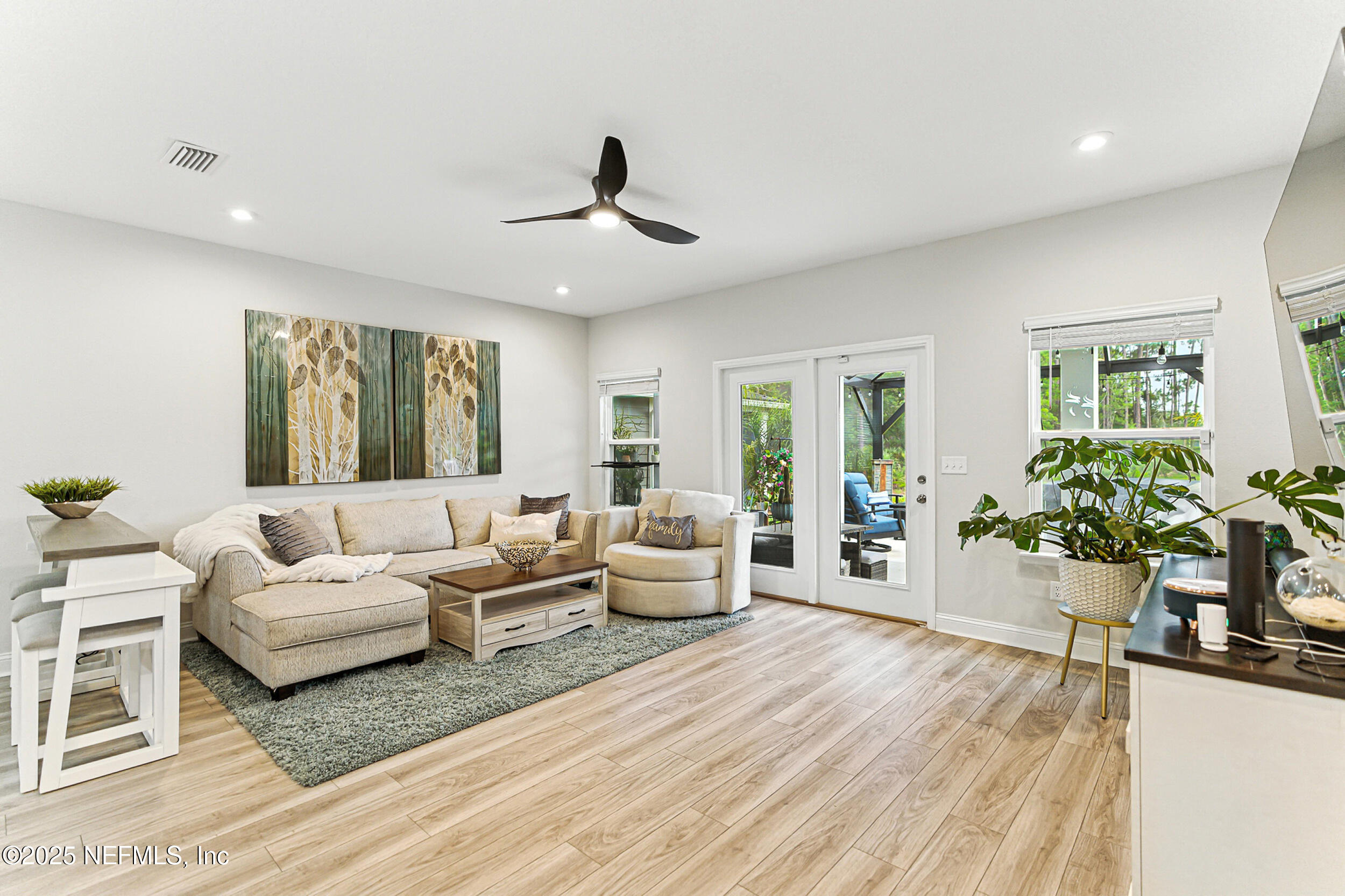 105 Meadow Creek Drive St. Johns, FL 32259 - Photo 7 of 37 a living room with furniture and a large window