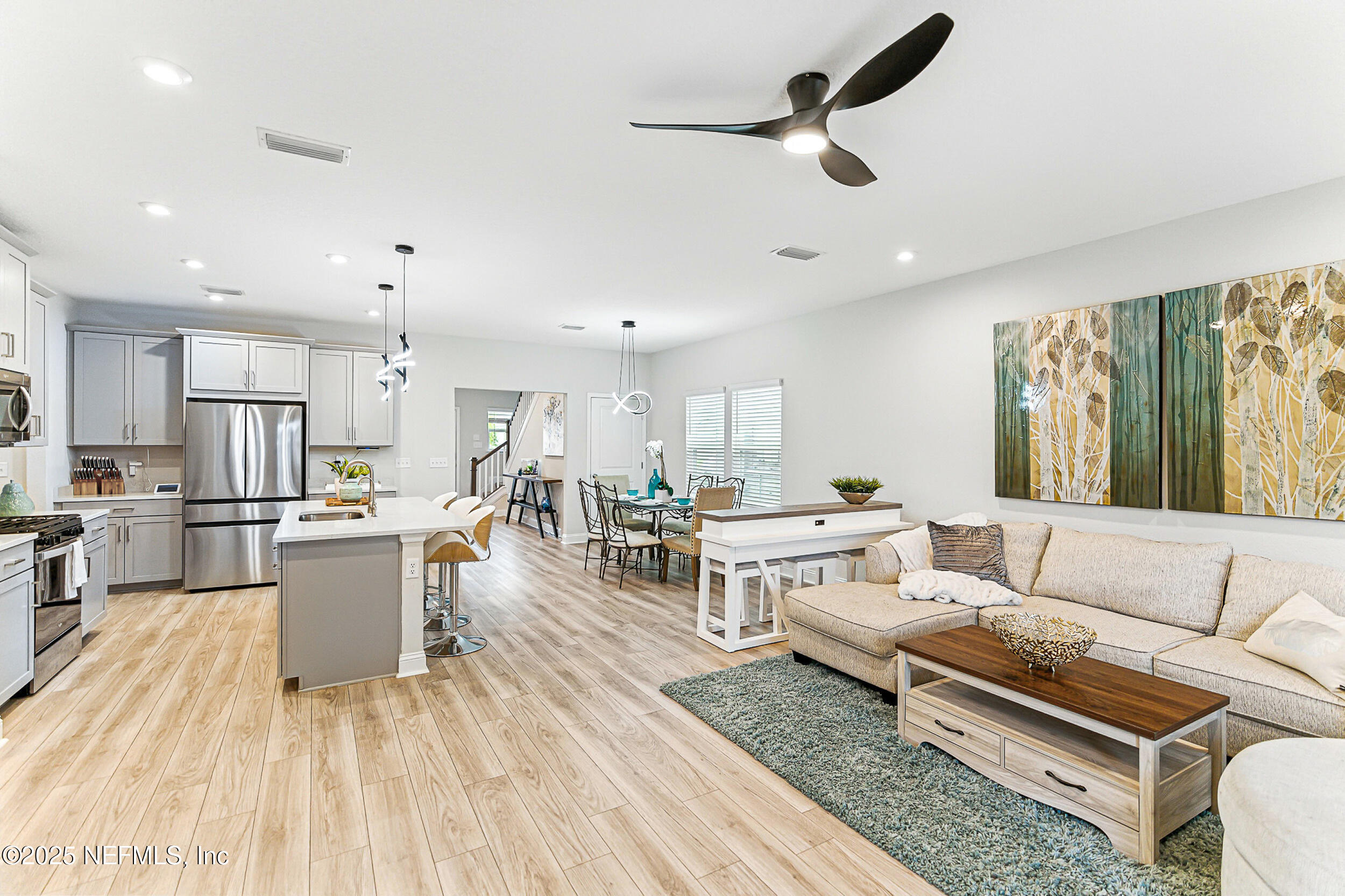 105 Meadow Creek Drive St. Johns, FL 32259 - Photo 8 of 37 a living room with furniture and kitchen view