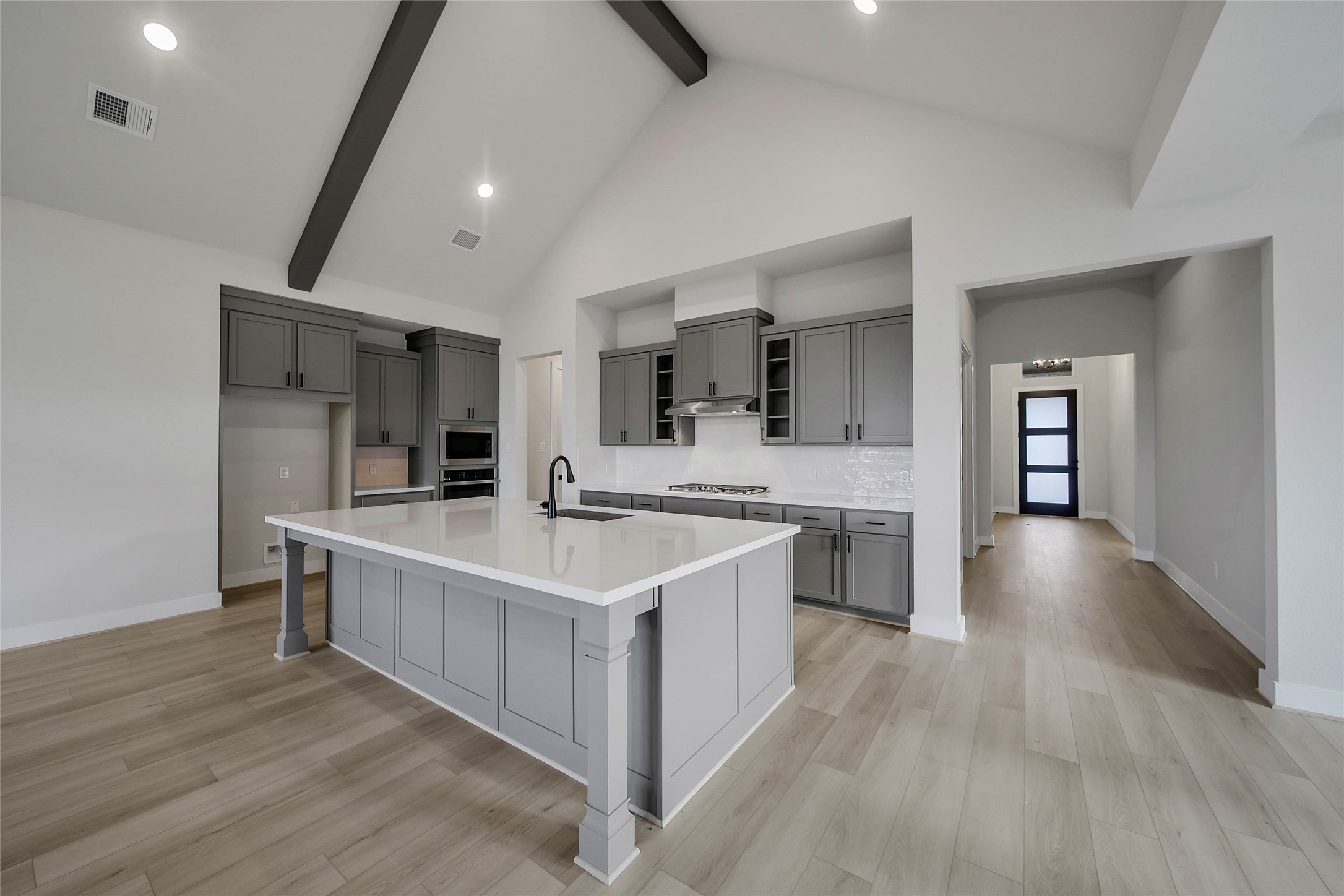 4519 Magnolia Bend Drive Rosharon, TX 77583 - Photo 12 of 48 a large kitchen with stainless steel appliances a sink and cabinets