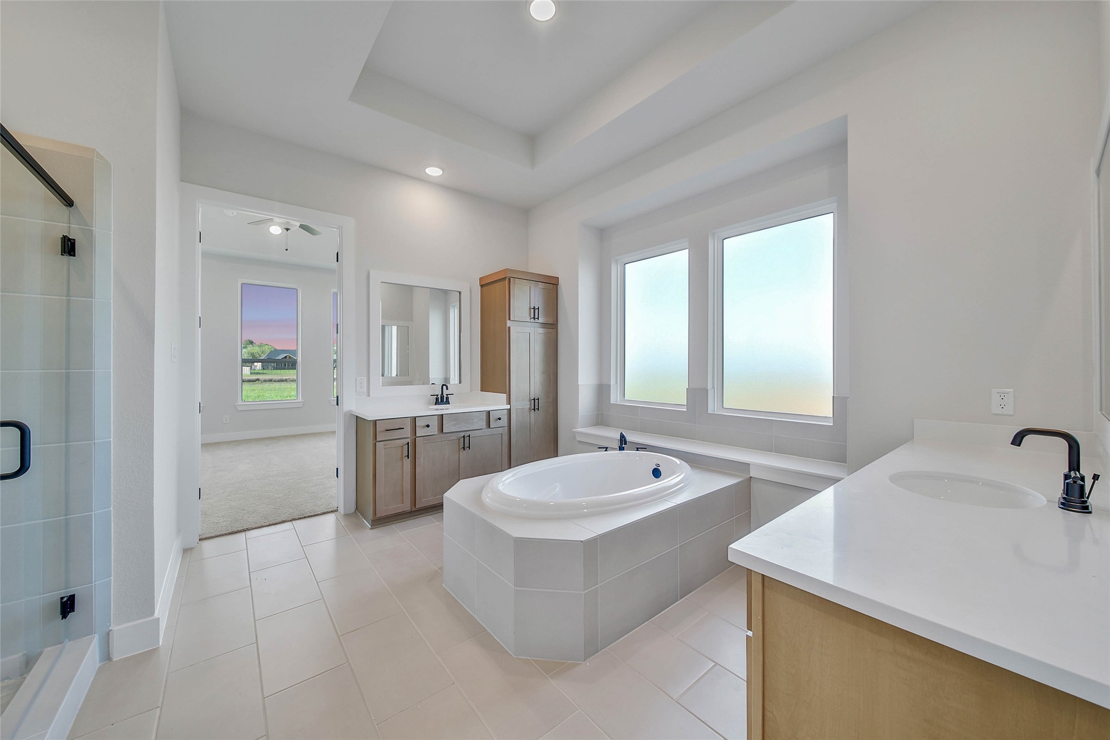 4519 Magnolia Bend Drive Rosharon, TX 77583 - Photo 17 of 48 a bathroom with a tub sink and mirror