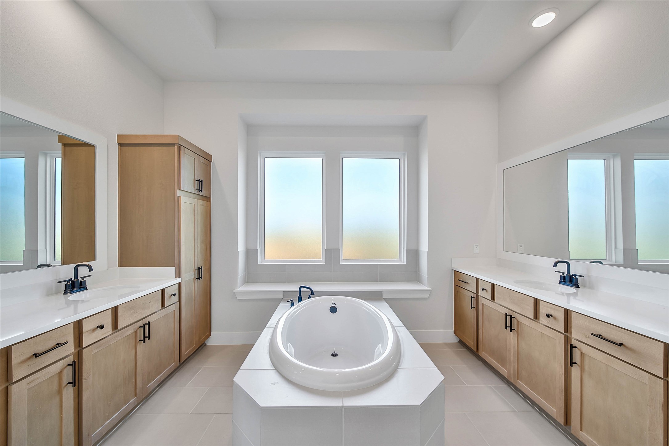 4519 Magnolia Bend Drive Rosharon, TX 77583 - Photo 18 of 48 a spacious bathroom with a double vanity sink a mirror and a bathtub