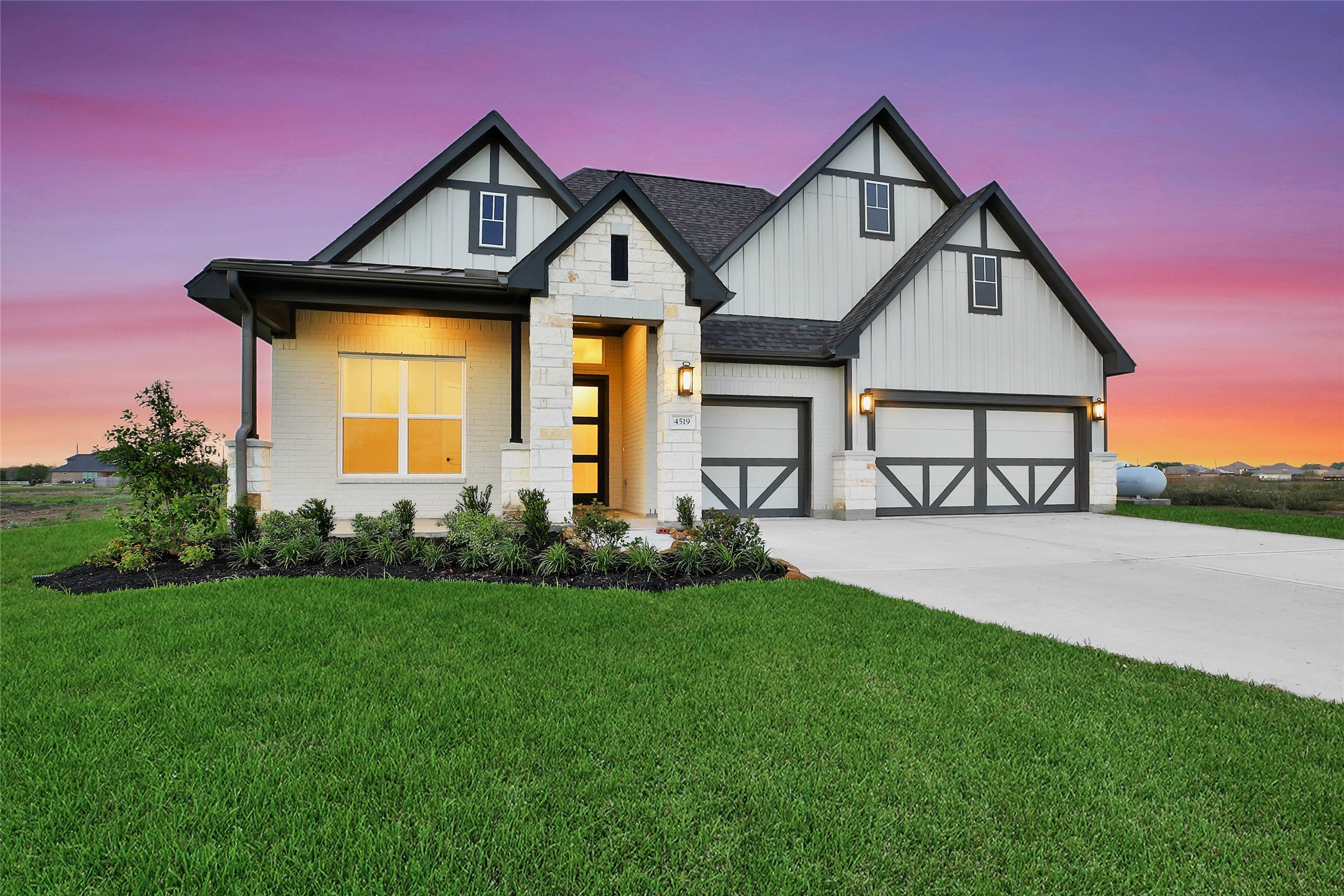 4519 Magnolia Bend Drive Rosharon, TX 77583 - Photo 2 of 48 a front view of a house with a yard and garage