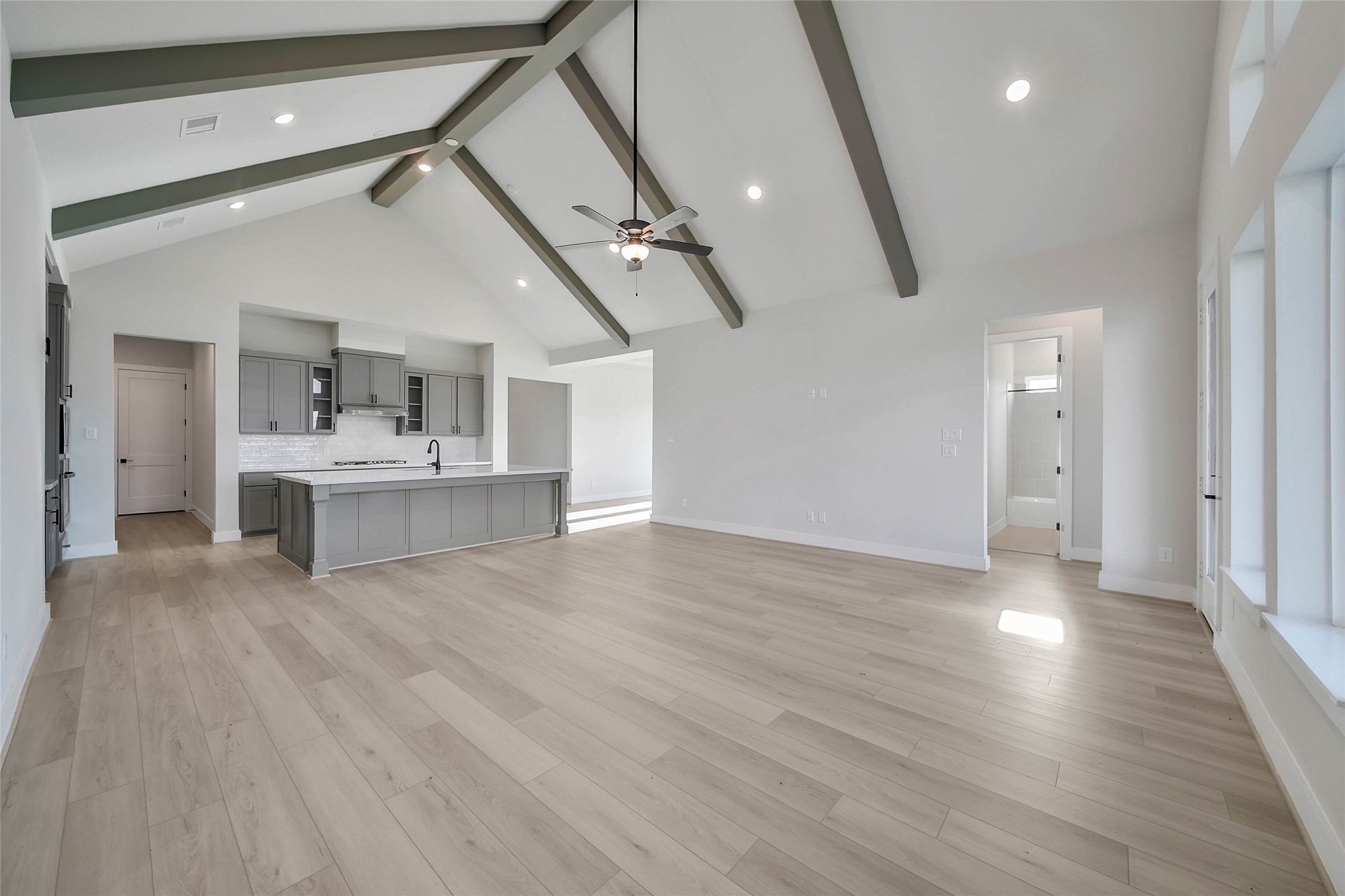 4519 Magnolia Bend Drive Rosharon, TX 77583 - Photo 5 of 48 an empty room with wooden floor and windows
