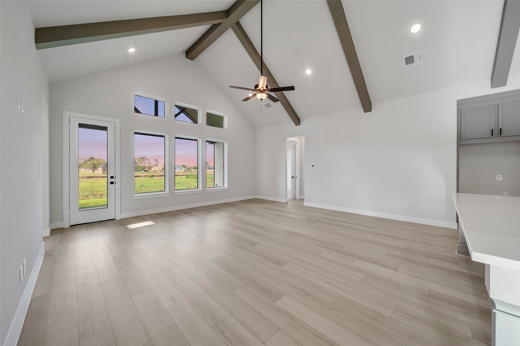 4519 Magnolia Bend Drive Rosharon, TX 77583 - Photo 6 of 48 a view of an empty room with a window and wooden floor