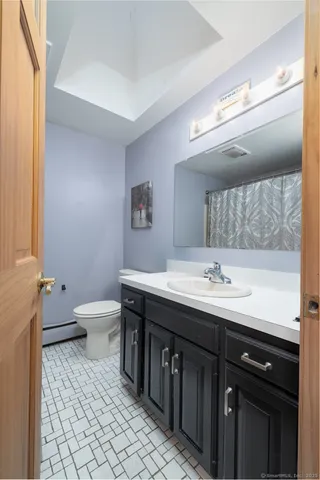 a living room with furniture and flowers