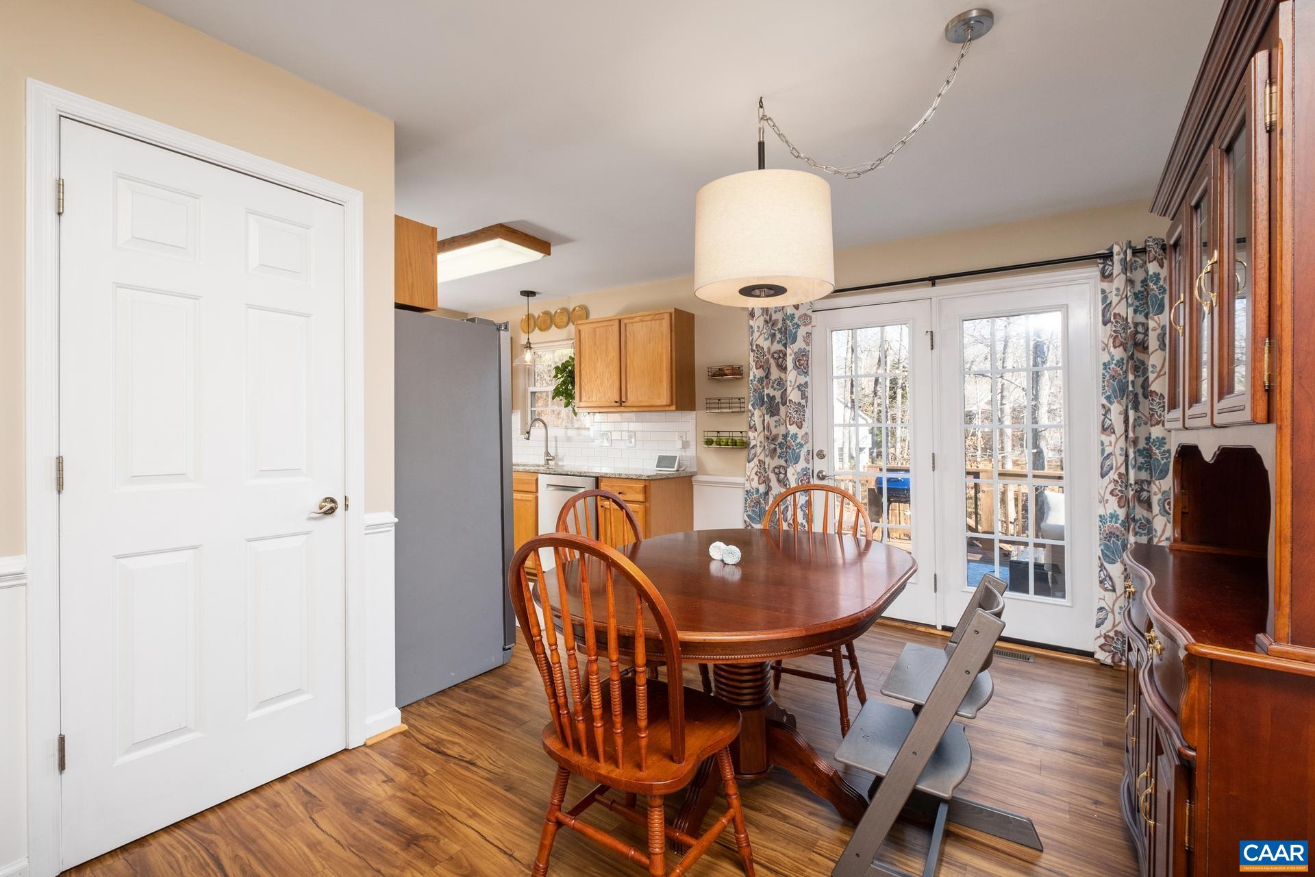 3 Powhatan Road Palmyra, VA 22963 - Photo 21 of 42 a dining room with furniture a chandelier and wooden floor