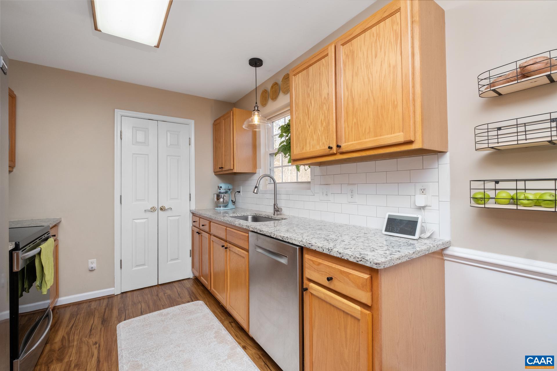 3 Powhatan Road Palmyra, VA 22963 - Photo 22 of 42 a kitchen with stainless steel appliances granite countertop a sink stove and cabinets