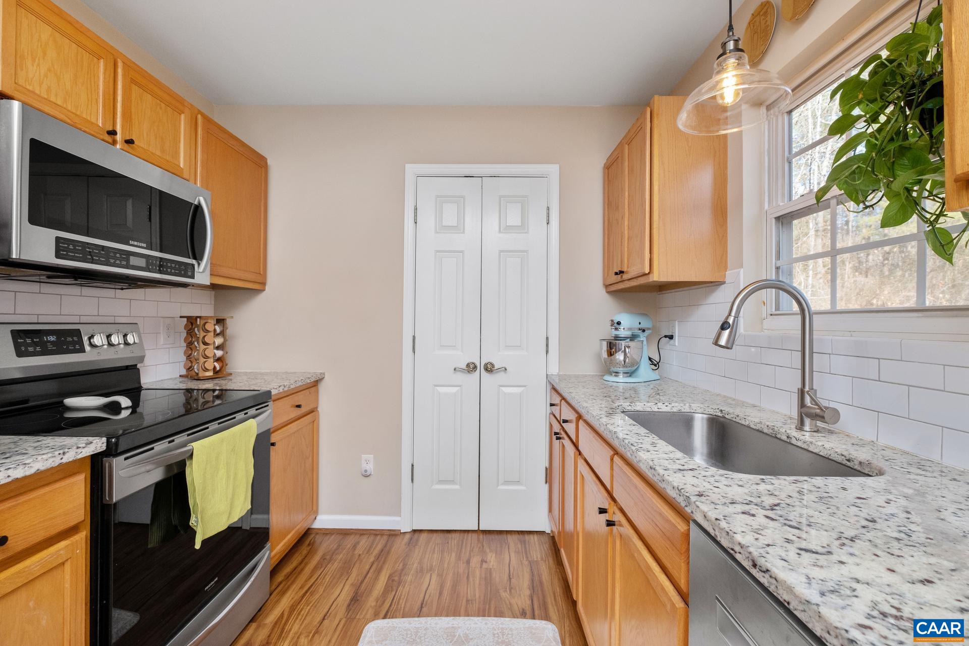 3 Powhatan Road Palmyra, VA 22963 - Photo 23 of 42 a kitchen with a sink stove and microwave