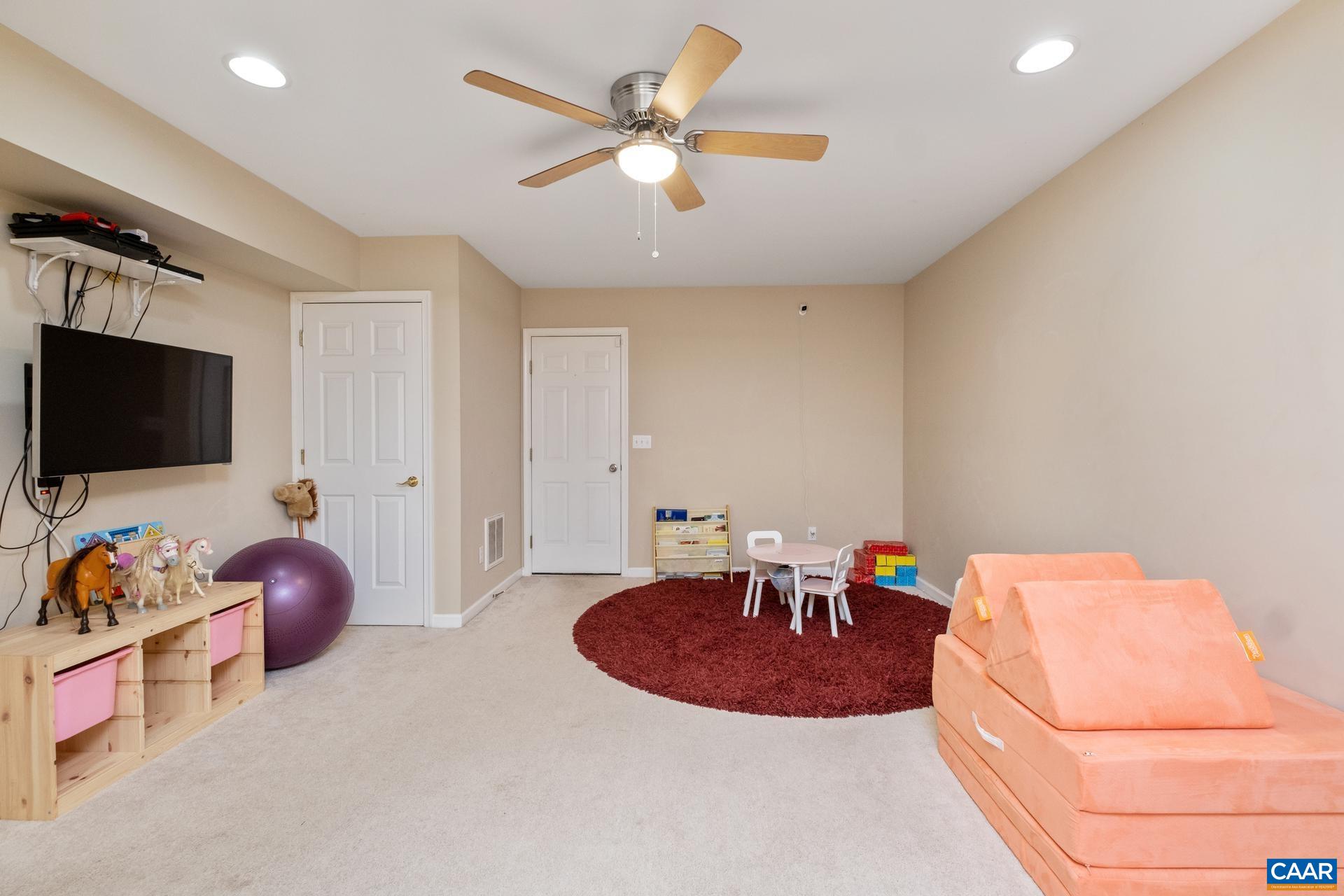 3 Powhatan Road Palmyra, VA 22963 - Photo 33 of 42 a room with furniture and a flat screen tv