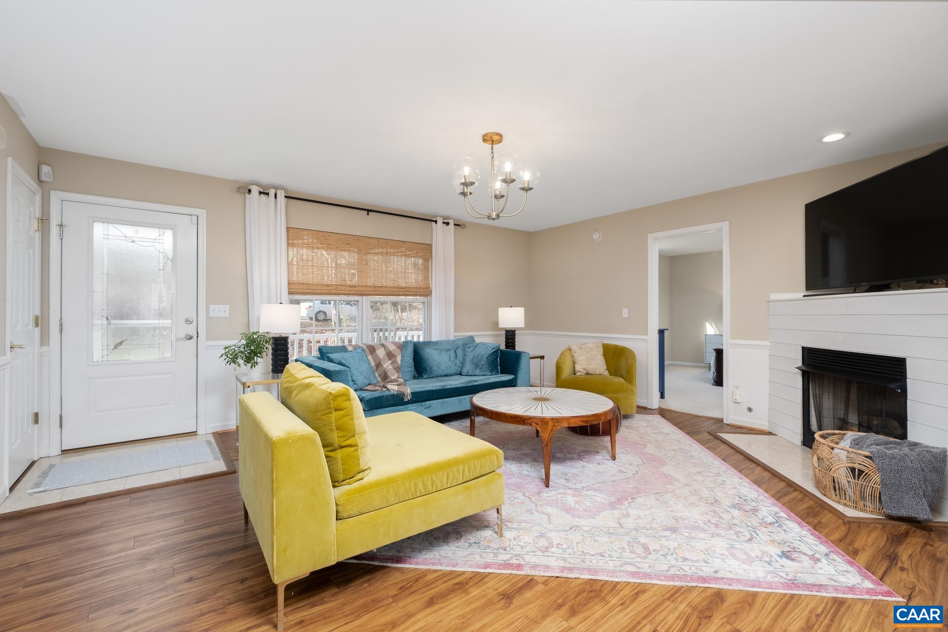 3 Powhatan Road Palmyra, VA 22963 - Photo 6 of 42 a living room with furniture fireplace and flat screen tv