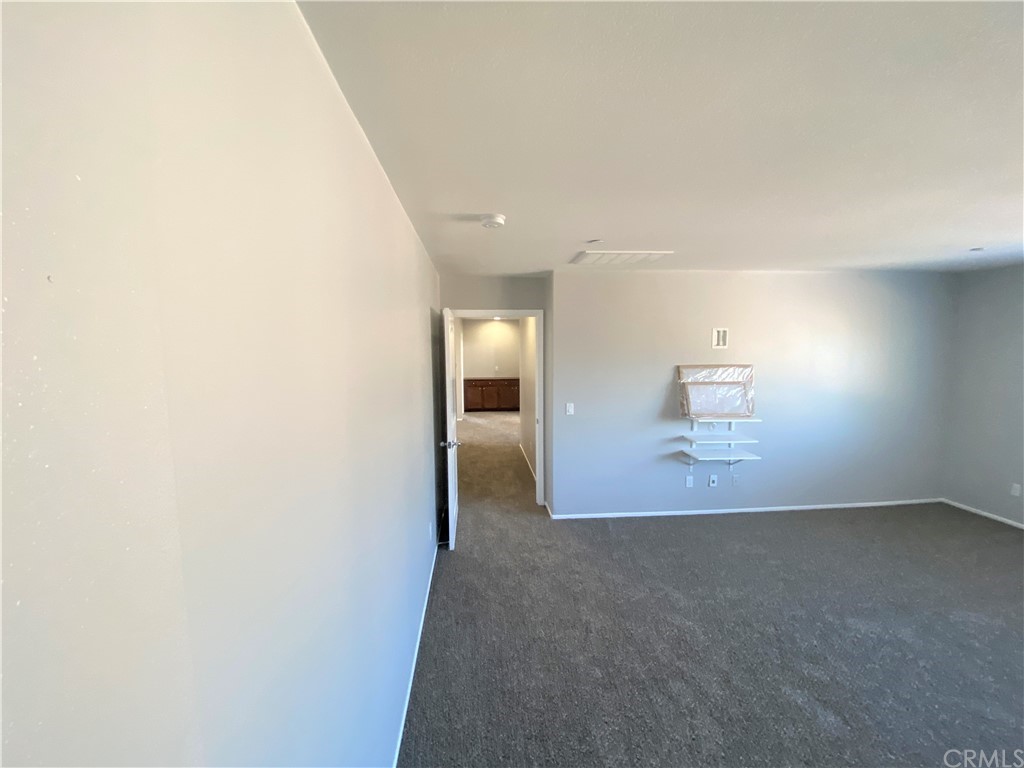 35123 Hulihee Street Winchester, CA 92596 - Photo 28 of 36 a view of a big room with wooden floor and windows