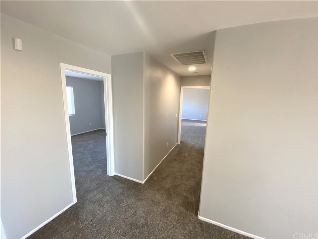35123 Hulihee Street Winchester, CA 92596 - Photo 29 of 36 an empty room with an entryway