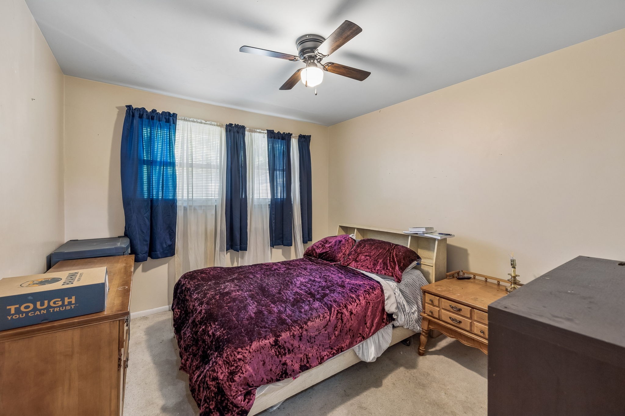 1246 Apache Lane Madison, TN 37115 - Photo 9 of 21 a bedroom with a bed and a chandelier