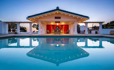 a view of a building with a swimming pool