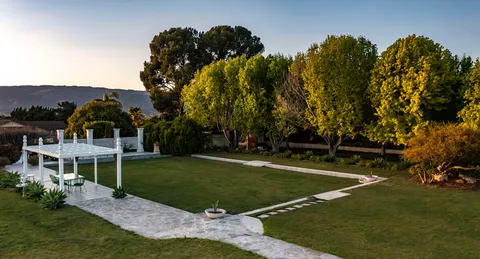 a view of a house with a big yard