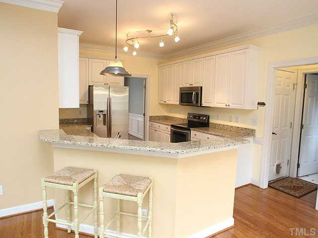 8009 Connestee Court Raleigh, NC 27612 - Photo 4 of 15 Beautiful granite countertops with stainless steel appliances Kitchen