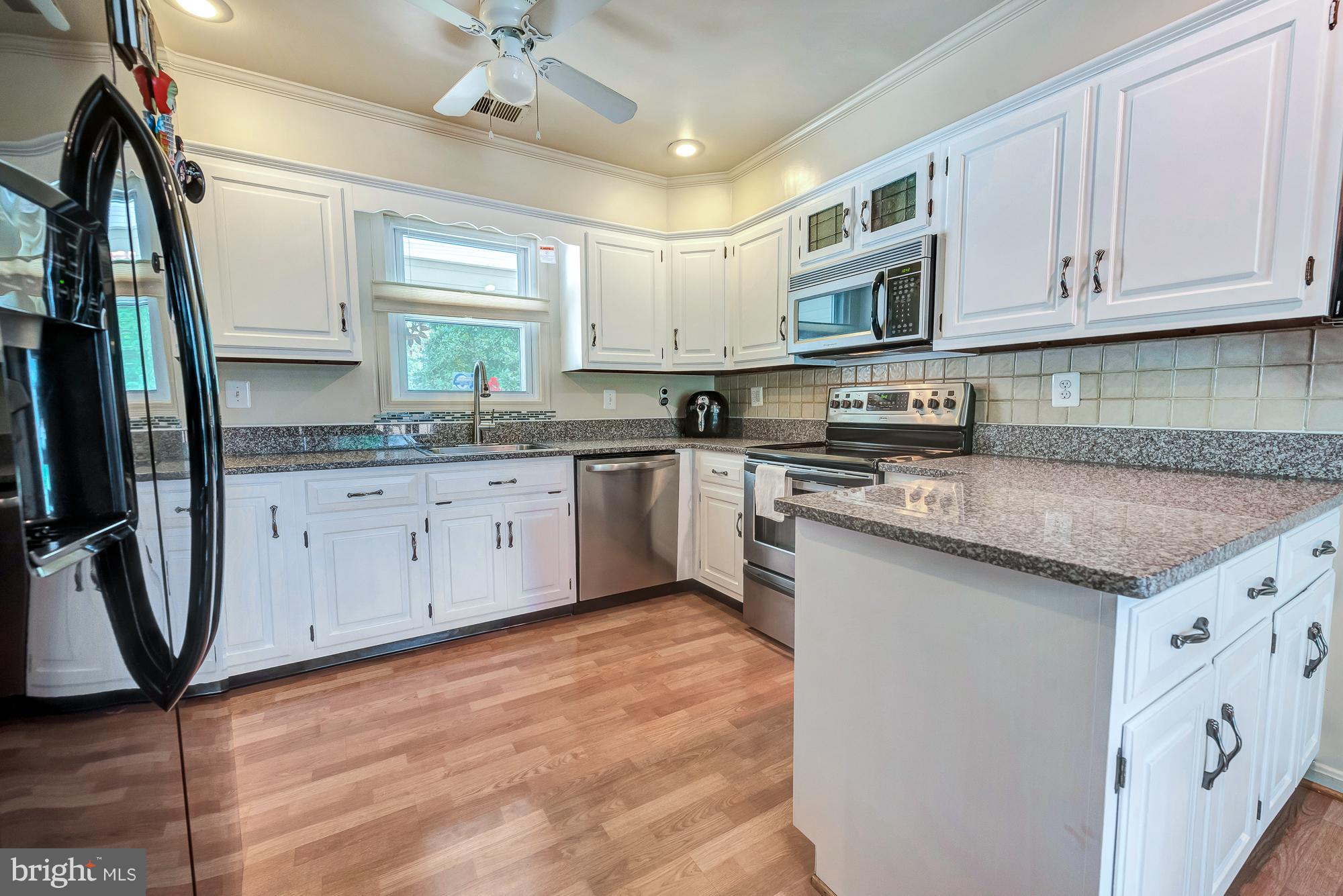 17310 Fletchall Road Poolesville, MD 20837 - Photo 16 of 30 This kitchen goes on forever!