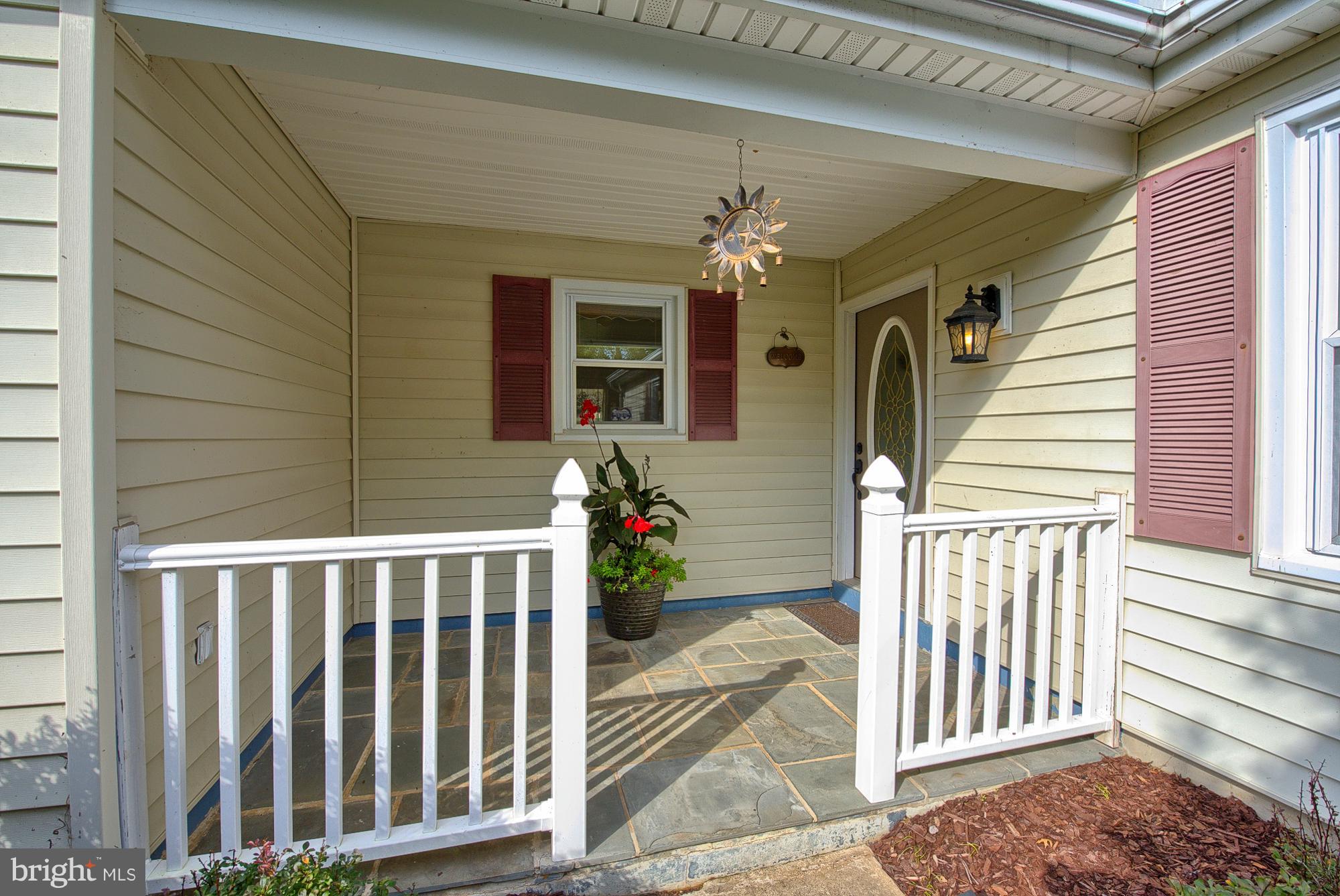 17310 Fletchall Road Poolesville, MD 20837 - Photo 8 of 30 Covered front exterior foyer with custom flagstone