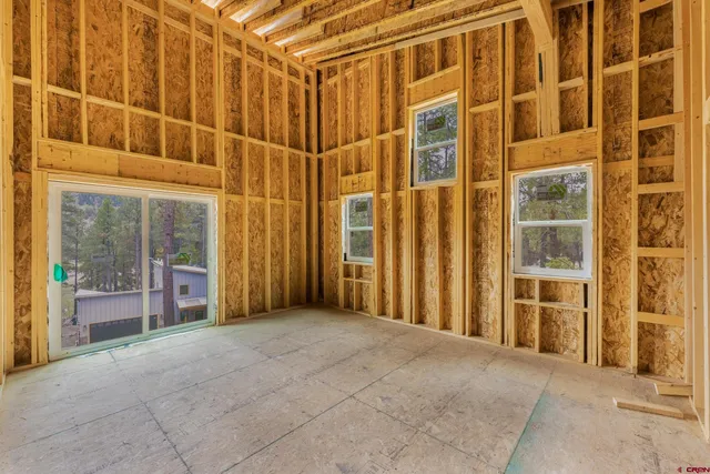 a view of a porch with a wooden door