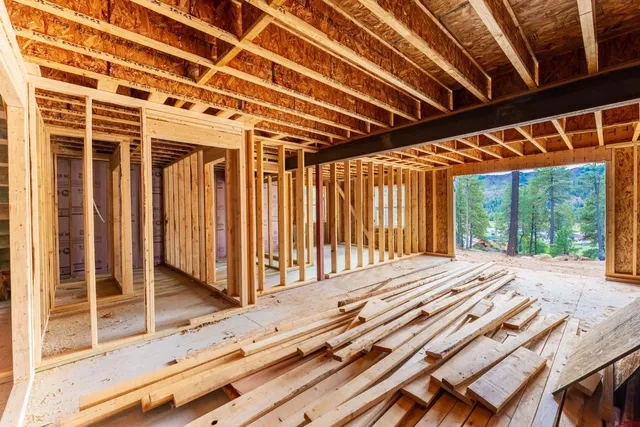 a view of a backyard with wooden floor and iron stairs