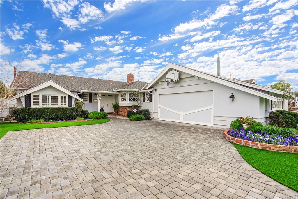 9422 Ruffner Avenue Northridge, CA 91343 - Photo 1 of 1 a front view of a house with a yard and garage