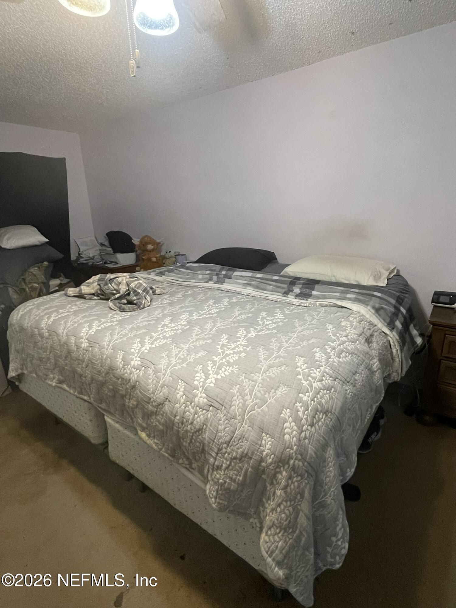 2946 Longleaf Ranch Circle Middleburg, FL 32068 - Photo 13 of 18 a bed sitting in a bedroom next to a window