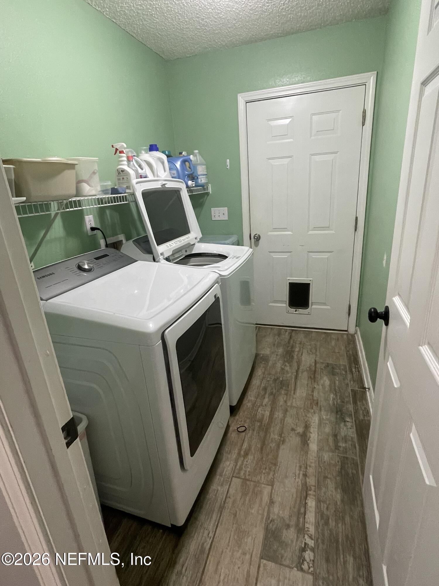 2946 Longleaf Ranch Circle Middleburg, FL 32068 - Photo 16 of 18 a utility room with dryer and washer