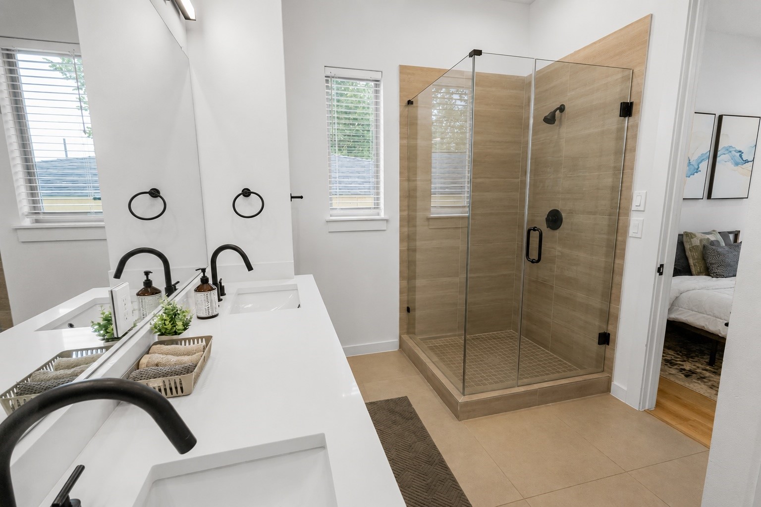 6742 Peerless Street, Unit B Houston, TX 77021 - Photo 16 of 32 Modern finishes elevate this spa inspired primary bath with a frameless glass shower, oversized vanity, quartz countertops, matte black fixtures, and warm porcelain tile. Clean lines and timeless materials create a polished space that blends style with everyday functionality.