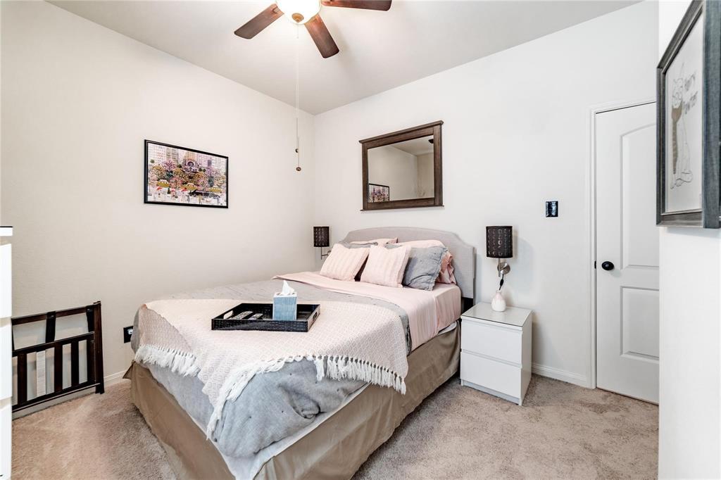 3021 Earl Road Anna, TX 75409 - Photo 15 of 20 a bedroom with bed and a chandelier