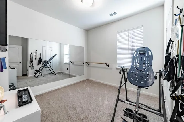 a view of gym equipment with a window