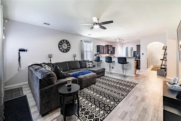 a living room with furniture and a table