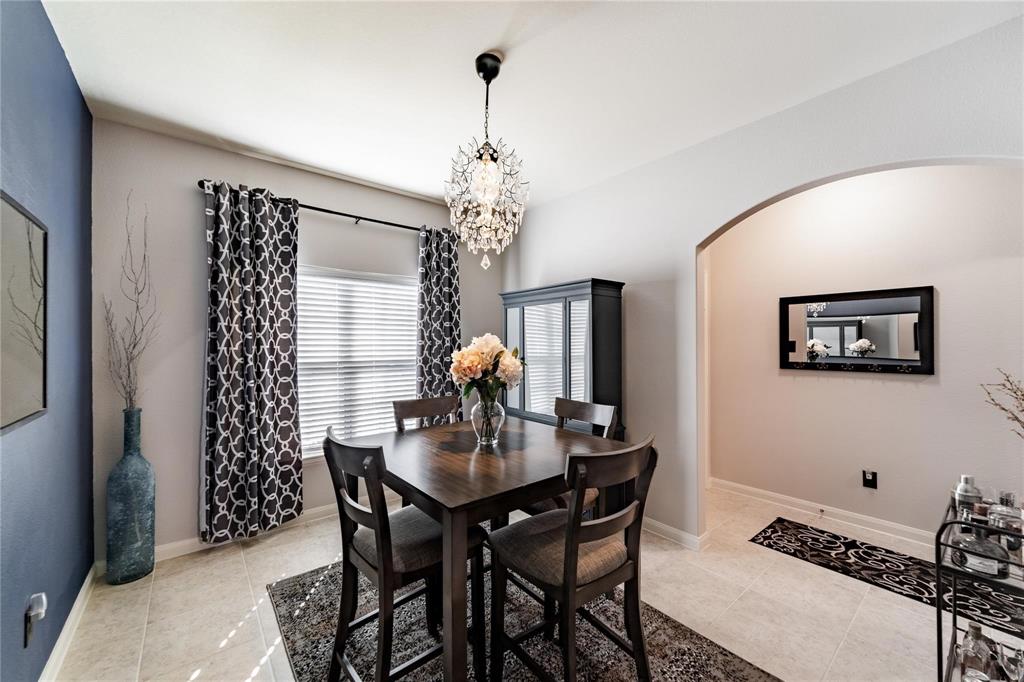 3021 Earl Road Anna, TX 75409 - Photo 4 of 20 a dining room with furniture a chandelier and window